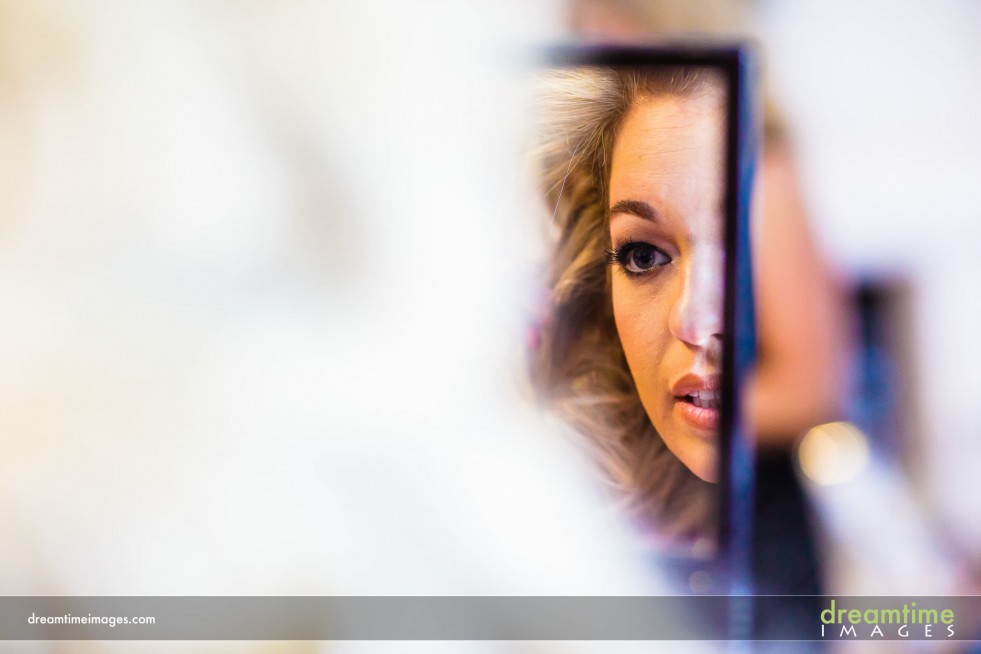 Bride looking into mirror at Sonnenalp Vail