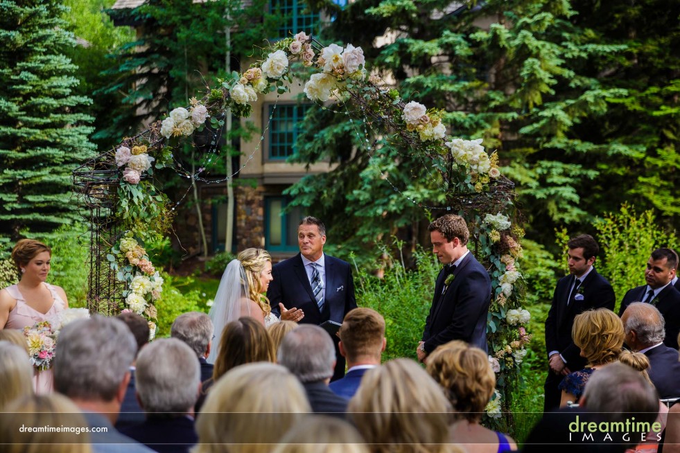 Ceremony in the garden next to the creek at the Sonnenalp