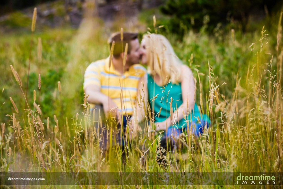Couple kissing in the grass