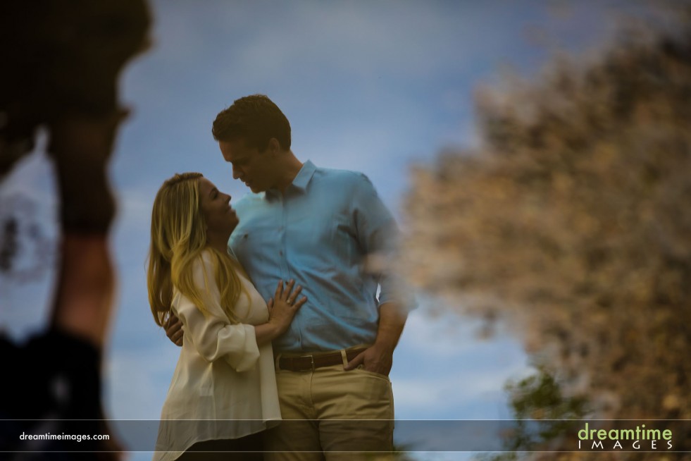 Reflection of couple in puddle in Colorado